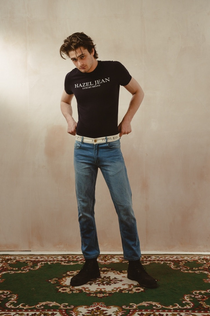 Ethical denim craftsmanship — hands stitching fabric